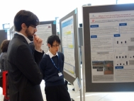 Presenting posters at an international academic conference.